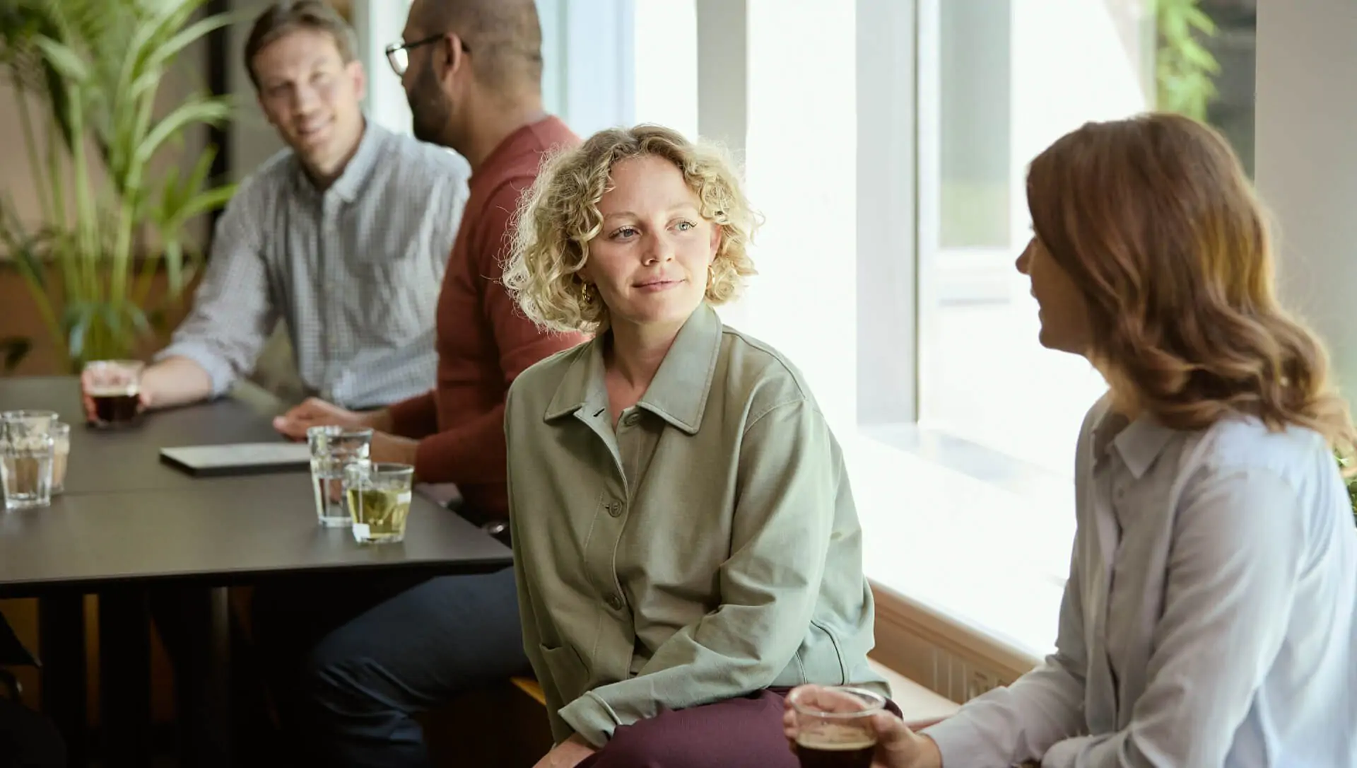people conversing in the office