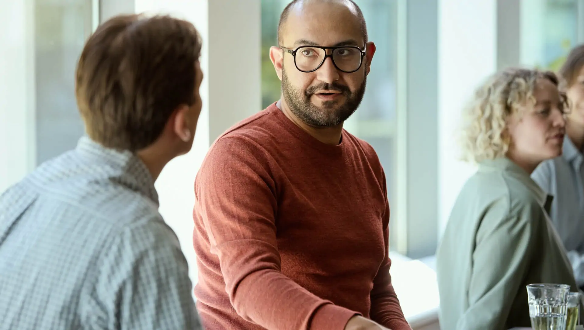 men sitting at the table and talking