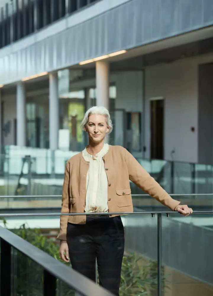 woman standing on an office bridge