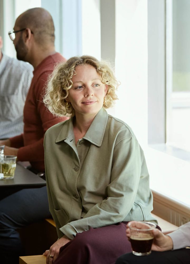 people conversing in the office